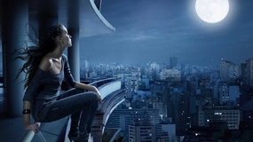 都市高楼美女赏月摄影图片